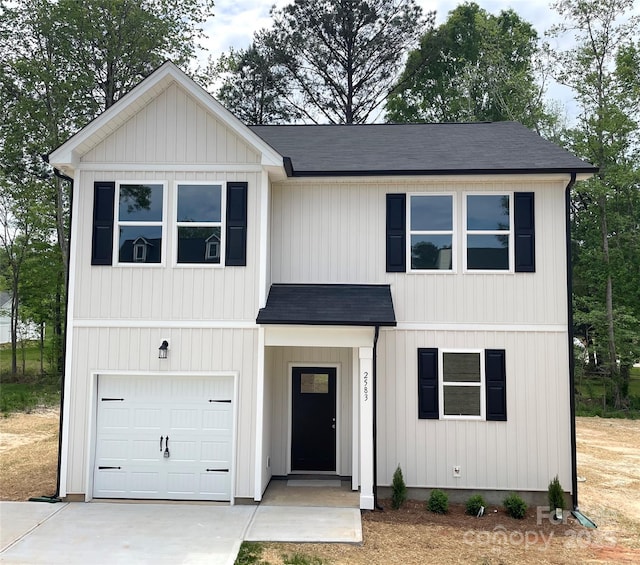 modern farmhouse style home with concrete driveway, a shingled roof, and an attached garage