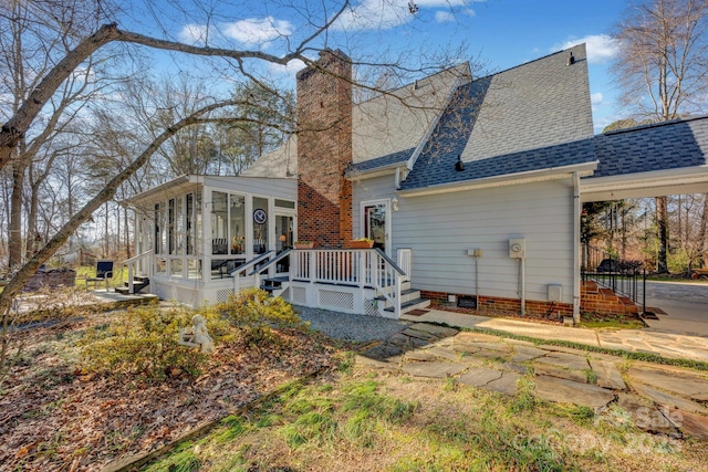 back of house with a sunroom