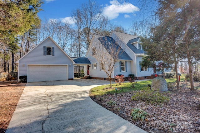 cape cod-style house with a front lawn and a garage