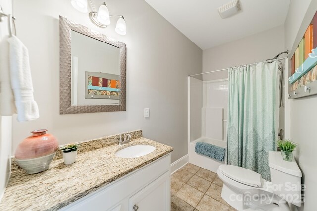 full bathroom featuring tile patterned floors, vanity, toilet, and shower / bath combo