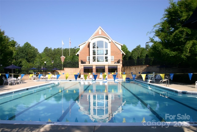 view of swimming pool with a patio