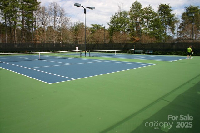 view of sport court with basketball hoop