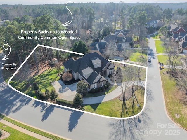 4150 Summit Ridge Ln, Denver, NC 28037 - aerial perspective of suburban area with property parcel outlined and a forest