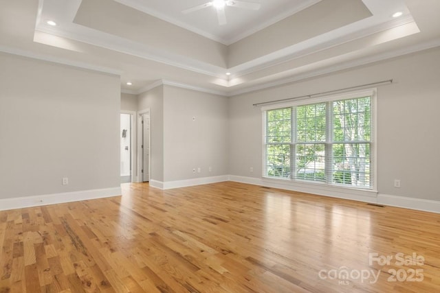4150 Summit Ridge Ln, Denver, NC 28037 - empty room with light wood finished floors, a ceiling fan, a raised ceiling, ornamental molding, and recessed lighting
