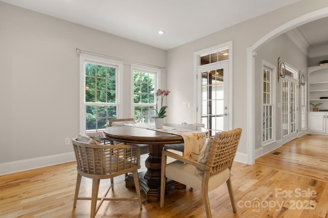 4150 Summit Ridge Ln, Denver, NC 28037 - dining space with arched walkways, light wood-style floors, baseboards, recessed lighting, and crown molding