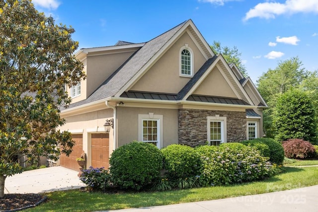 4150 Summit Ridge Ln, Denver, NC 28037 - view of front of property with stucco siding, an attached garage, a standing seam roof, concrete driveway, and stone siding