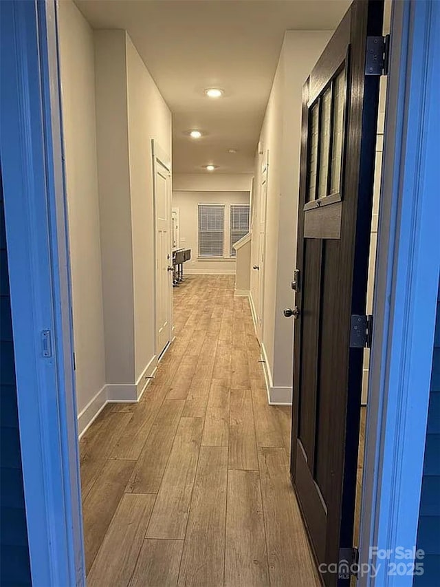 hallway featuring light hardwood / wood-style flooring