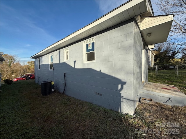 view of side of property with central AC