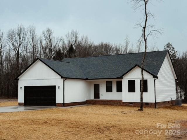 modern inspired farmhouse with a garage