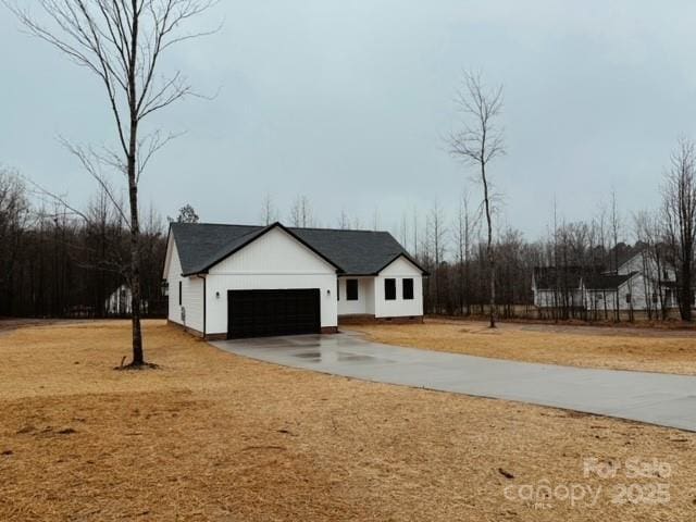 modern farmhouse style home featuring a garage