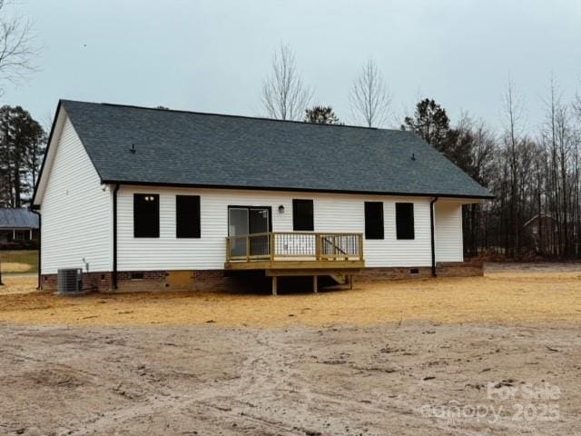 back of property with a deck and central air condition unit