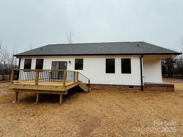 rear view of house featuring a deck