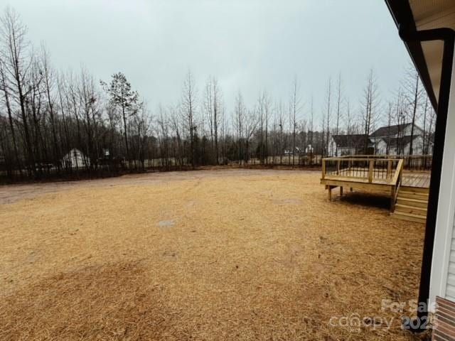 view of yard featuring a wooden deck