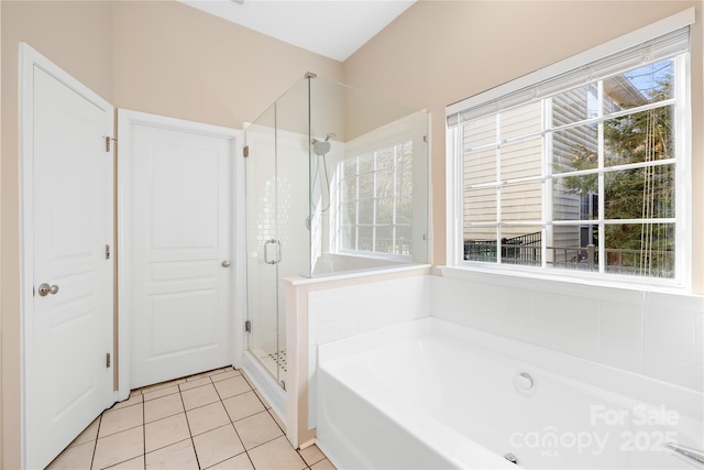 bathroom featuring tile patterned flooring, shower with separate bathtub, and plenty of natural light