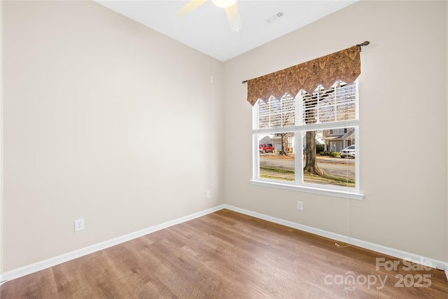 unfurnished room featuring ceiling fan and hardwood / wood-style floors