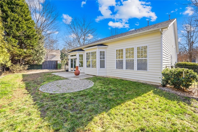 back of house with a yard and a patio area