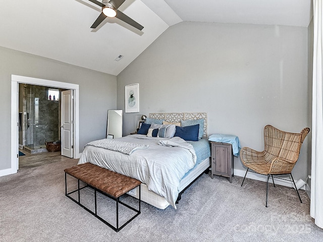 bedroom with ceiling fan, light colored carpet, ensuite bath, and vaulted ceiling