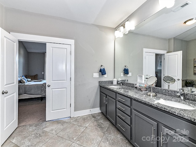 bathroom featuring tile patterned floors and vanity