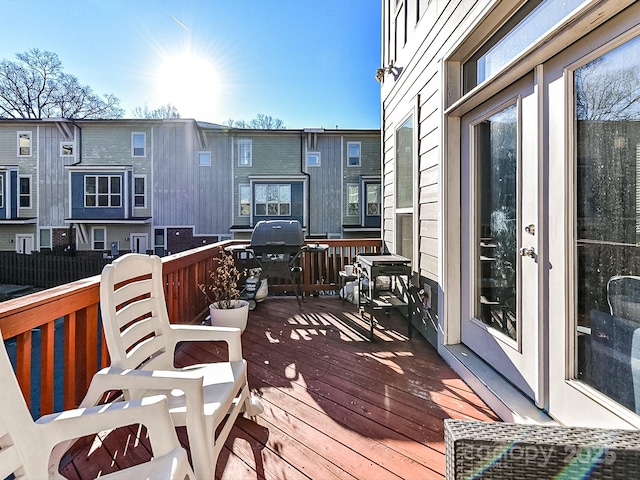 wooden terrace featuring grilling area