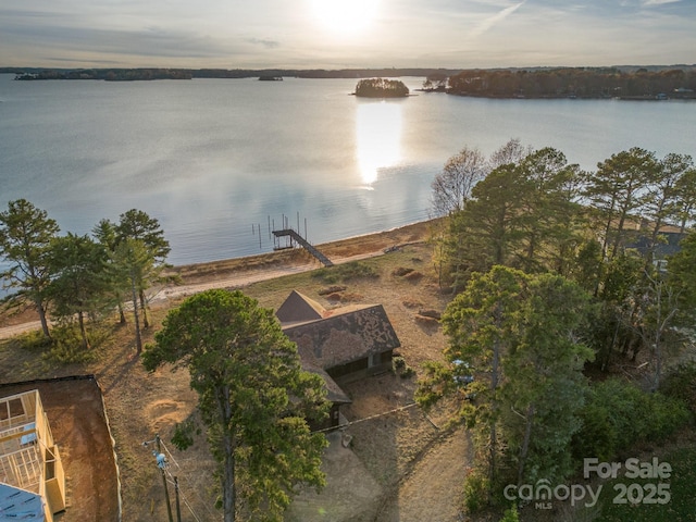 aerial view at dusk with a water view