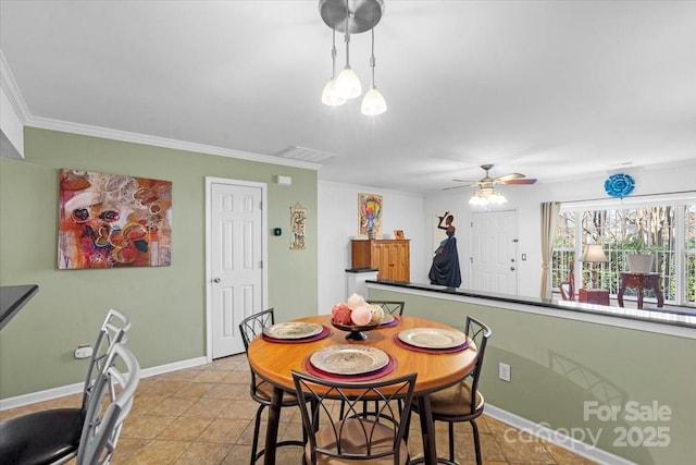 dining area featuring ceiling fan, crown molding, and light tile patterned floors