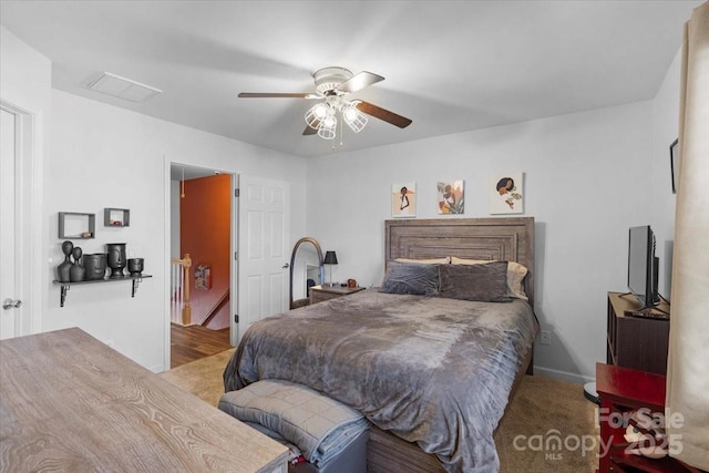 bedroom featuring light colored carpet and ceiling fan