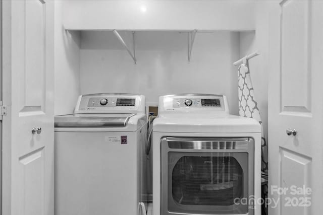 laundry room featuring separate washer and dryer