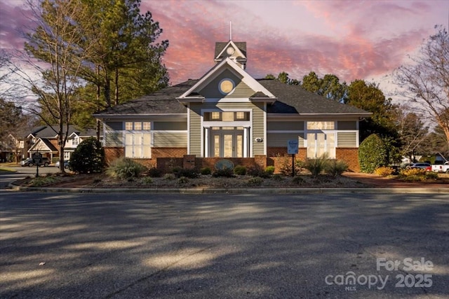 view of outdoor building at dusk