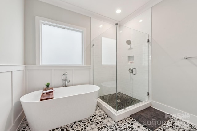 bathroom with tile patterned floors and independent shower and bath