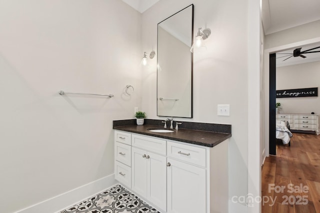 bathroom with ceiling fan and vanity