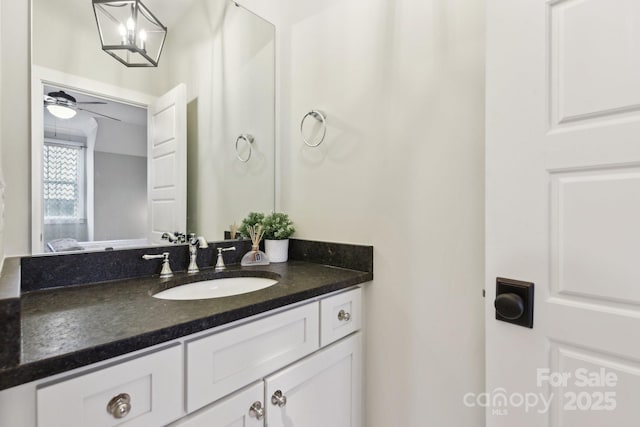 bathroom with ceiling fan and vanity