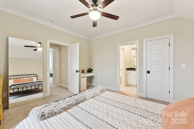 carpeted bedroom with ceiling fan, crown molding, and ensuite bathroom