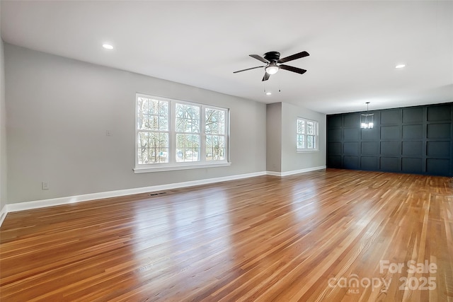 unfurnished room with light hardwood / wood-style floors and ceiling fan