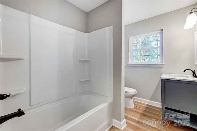 full bathroom featuring shower / bath combination, vanity, toilet, and wood-type flooring