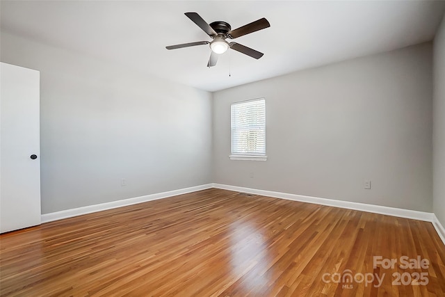 empty room featuring ceiling fan and wood-type flooring