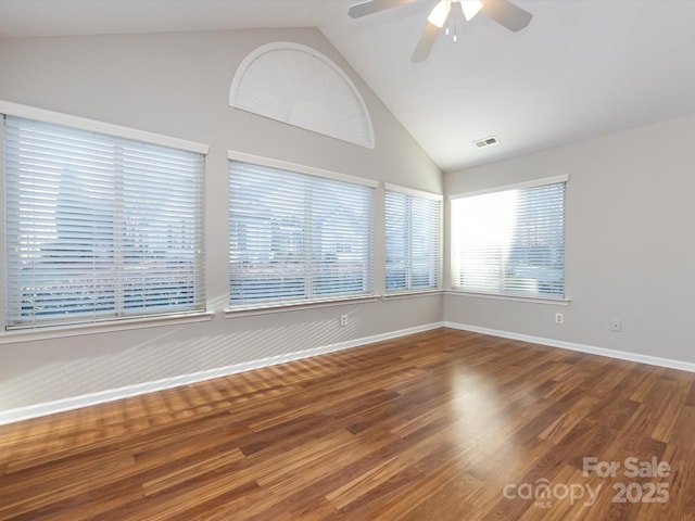 unfurnished room featuring hardwood / wood-style flooring, ceiling fan, and lofted ceiling