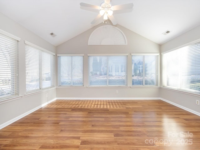 unfurnished sunroom featuring ceiling fan and lofted ceiling