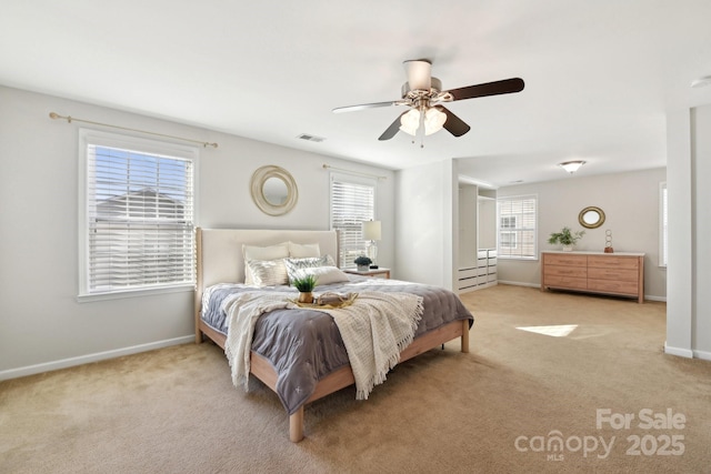 bedroom with light colored carpet and ceiling fan