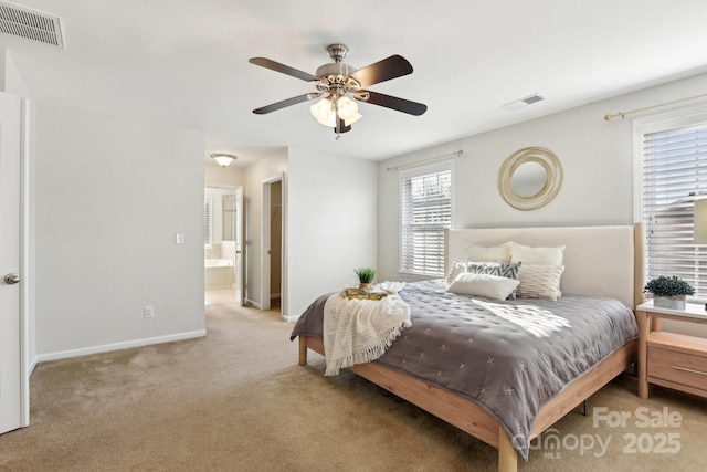 carpeted bedroom featuring ensuite bathroom and ceiling fan