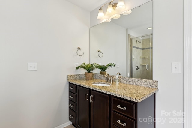 bathroom featuring vanity and a shower with shower door