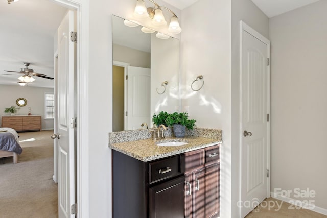 bathroom featuring ceiling fan and vanity