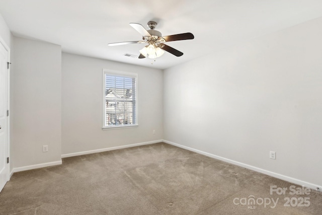 unfurnished room featuring light carpet and ceiling fan