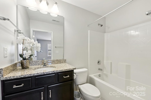 full bathroom with vanity, bathtub / shower combination, and toilet