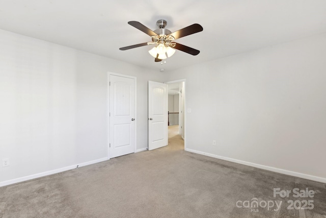 unfurnished bedroom featuring carpet floors and ceiling fan