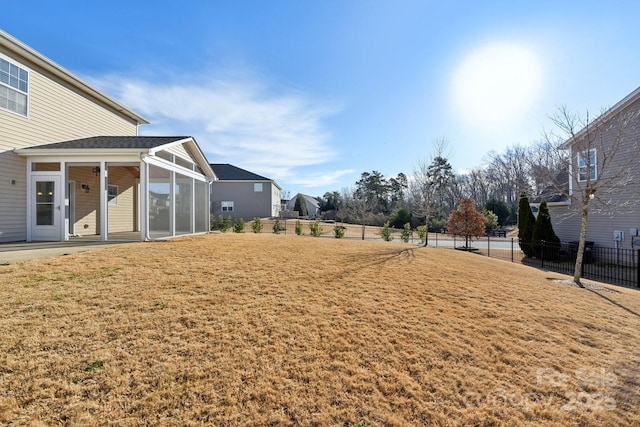 view of yard featuring a sunroom