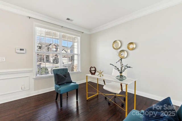 living area featuring crown molding and dark wood-type flooring