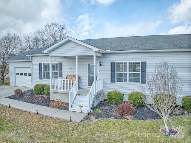 ranch-style home with a porch and a garage