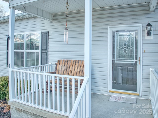 entrance to property featuring a porch