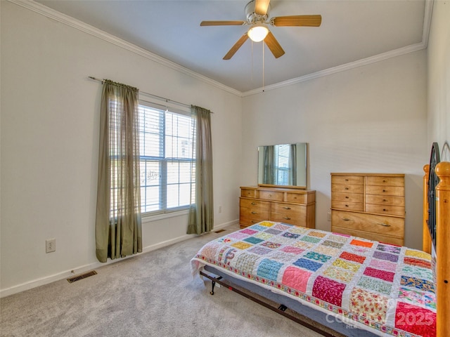 bedroom with ceiling fan, carpet floors, and ornamental molding