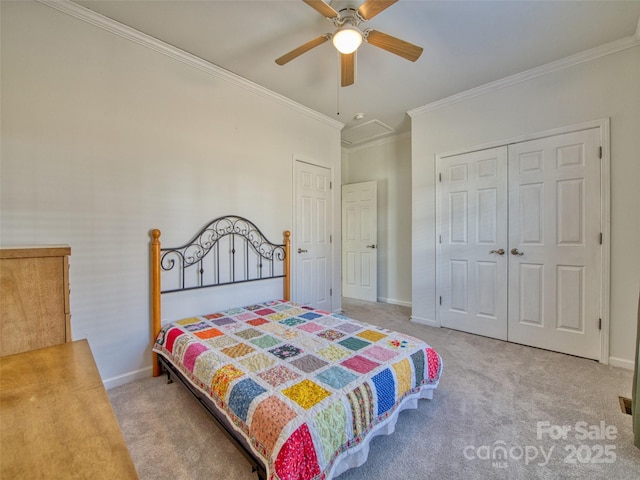 bedroom featuring carpet, a closet, ceiling fan, and ornamental molding